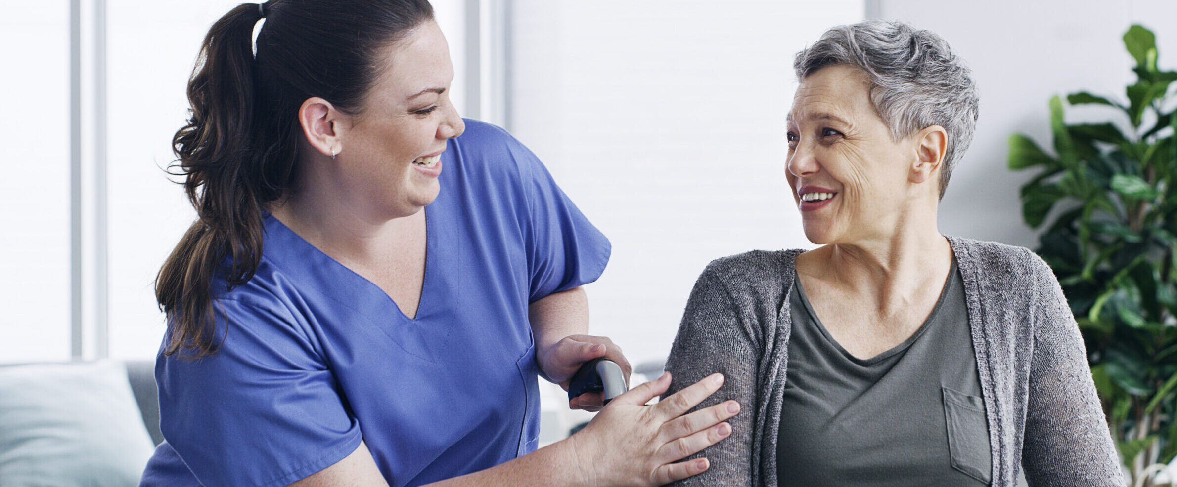 Shot of a senior woman in a wheelchair being cared for by a nurse